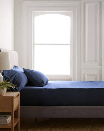 the indigo blue linen sheets on a bed
