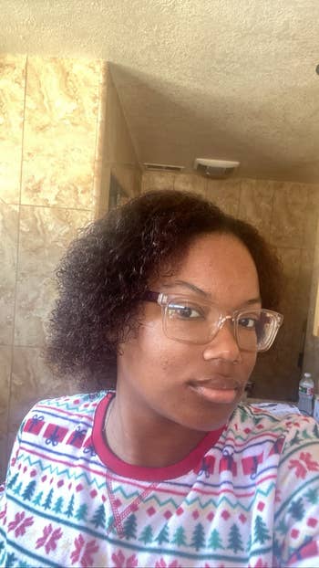 A reviewer with curly hair