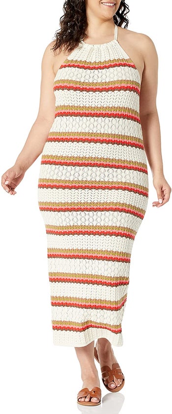 model wearing the dress in red and cream stripes