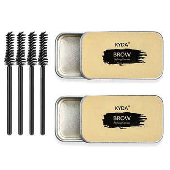 two tins of product and four applicator brushes