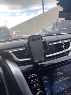 the phone holder attached to a car vent