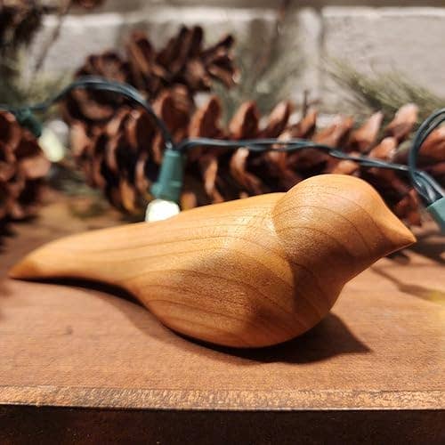 Wooden vertebrate  figurine connected  show  with conifer  cones and drawstring  lights, suitable for location  decor oregon  gifting
