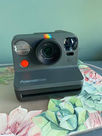 reviewer's black polaroid camera