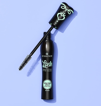 the tube of mascara on a blue background