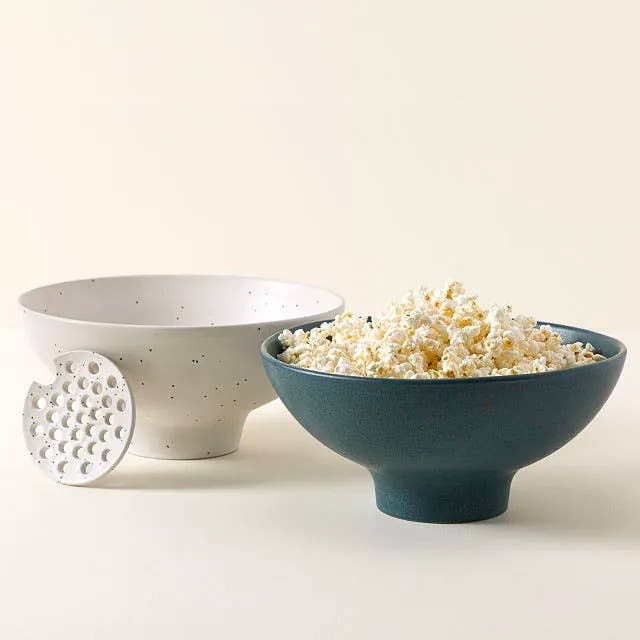 two ceramic bowls, one white and one blue-green