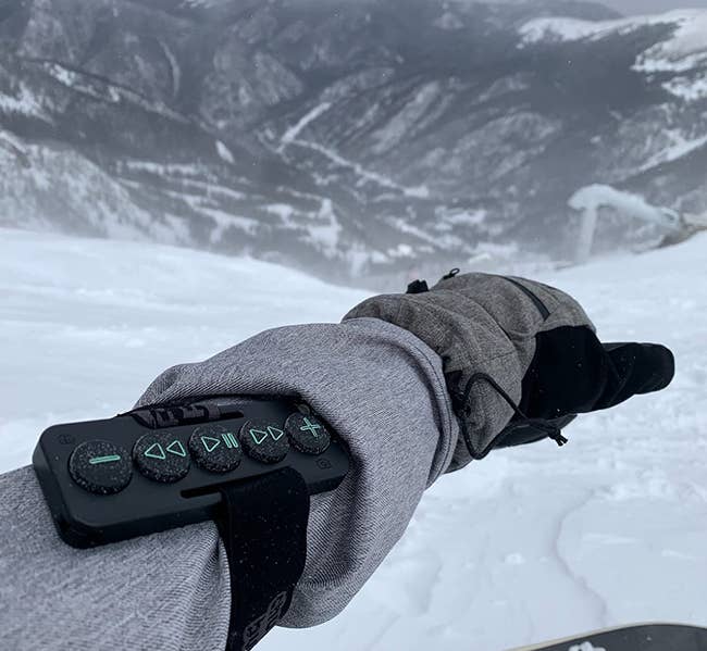 a reviewer out skiing with the chubby buttons strapped on their forearm 