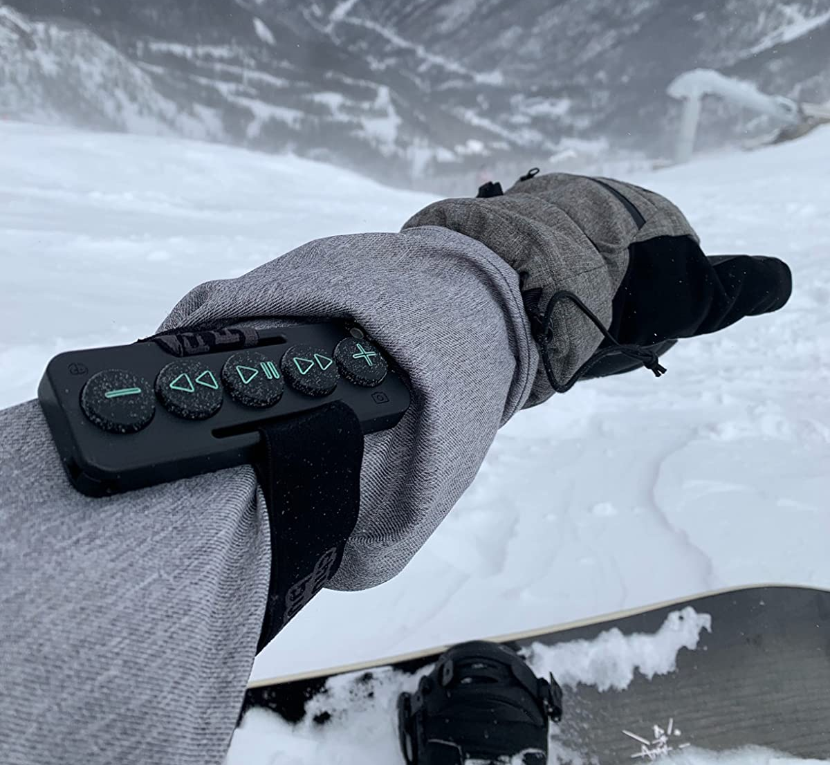 a reviewer out skiing with the chubby buttons strapped on their forearm 