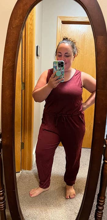 a different reviewer wearing the wine red jumpsuit in XL