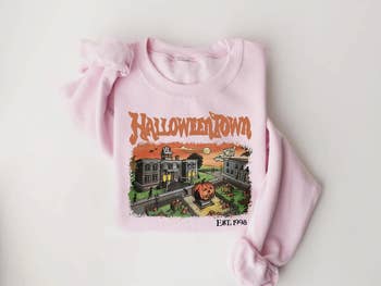Pink sweatshirt featuring