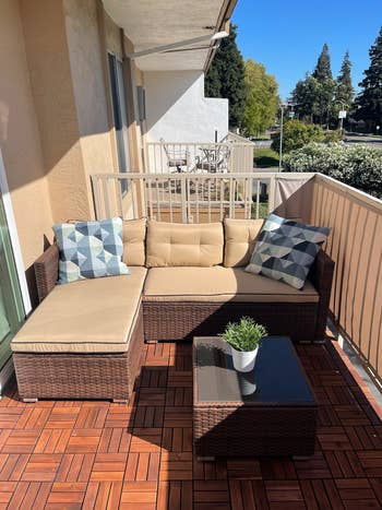 reviewer's beige three-piece sectional on a balcony