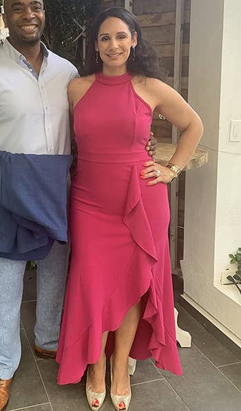 Image of reviewer wearing pink dress
