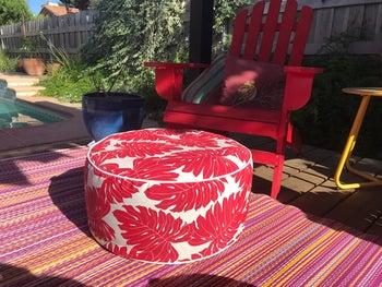 reviewer image of a red ottoman outside