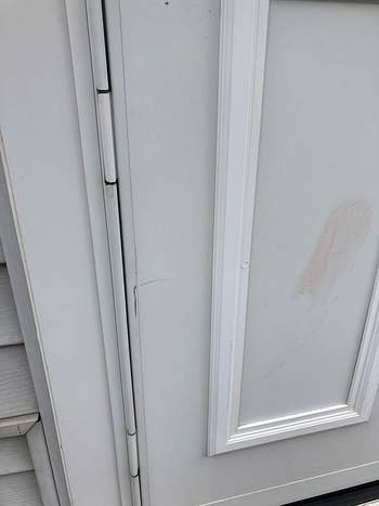 a reviewer photo of a dirty exterior door 