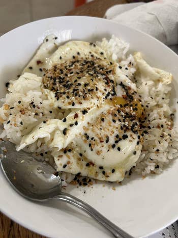 bowl of atom   topped with fried eggs and the atom   seasoning
