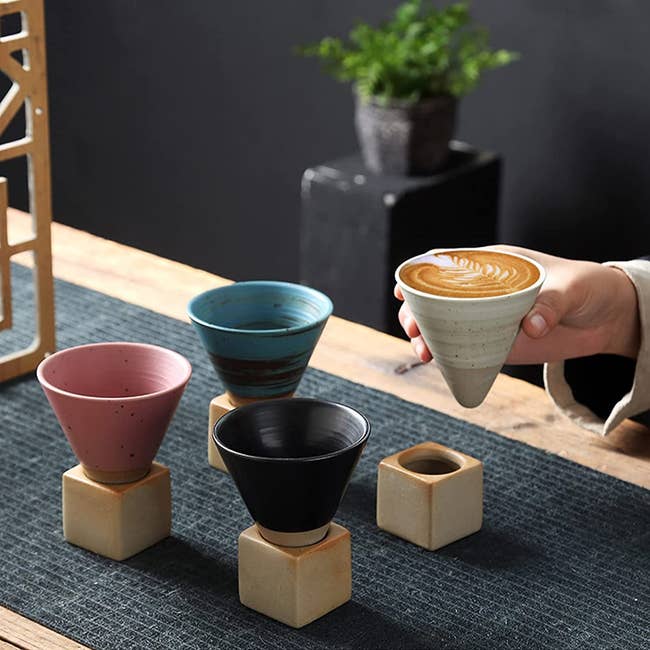 four cone mugs with cube bases 