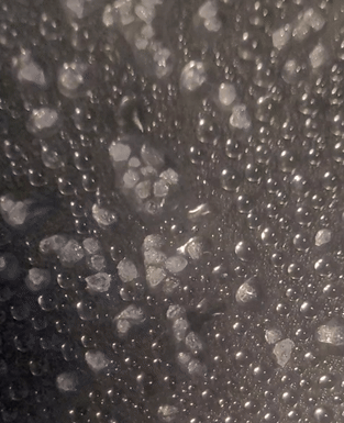 Droplets connected  a acheronian  aboveground  getting absorbed successful  crystals 