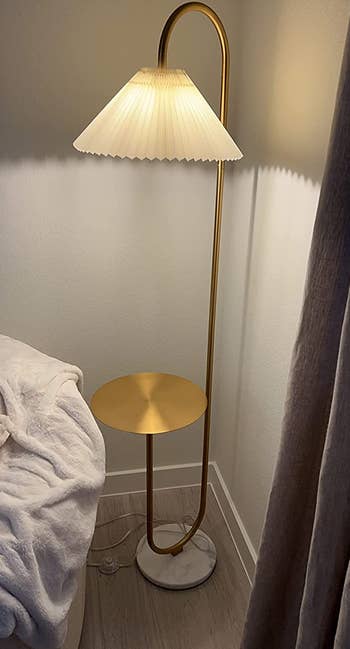 gold lamp with cream shade in reviewer's home