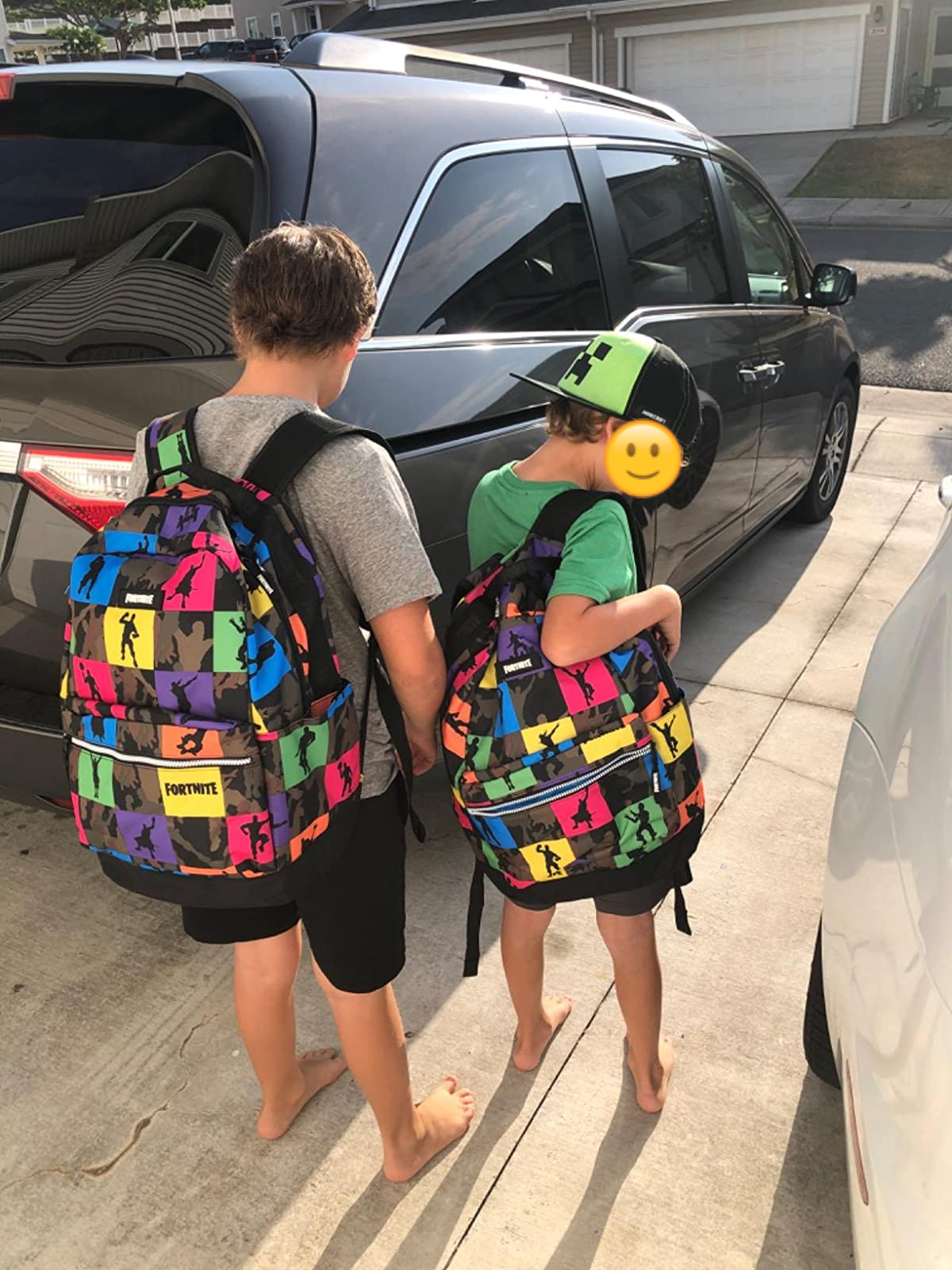 reviewer's photo of two children with the backpacks