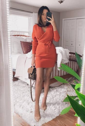 Reviewer wearing the same dress but in an orange color