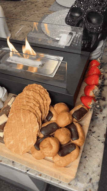 gif of my friends black burning fire pit on s'mores charcuterie board
