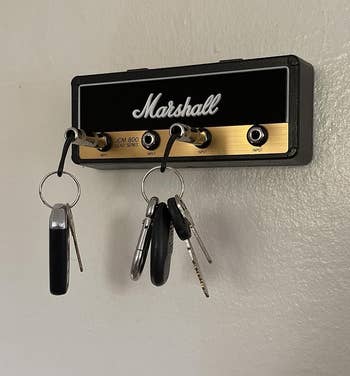 Key holder designed like a Marshall amplifier with keys hanging on metal jack plugs