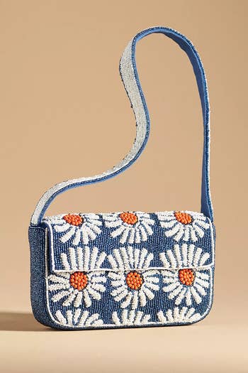 Beaded handbag with daisy pattern and shoulder strap, suitable for casual style