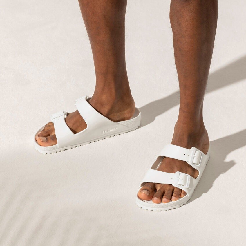model wearing the sandals in white
