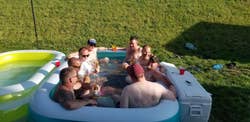Group of reviewers in the inflatable pool