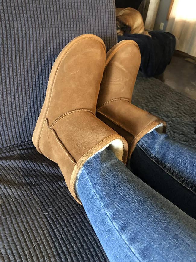 A reviewer wearing the boots in tan