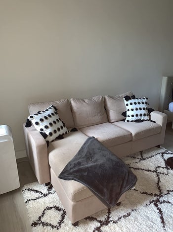 reviewer photo of a beige sectional couch