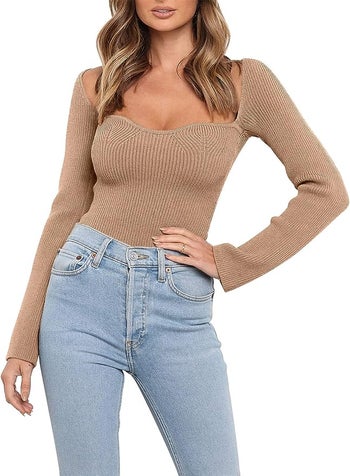 front view of a model wearing the sweater in tan