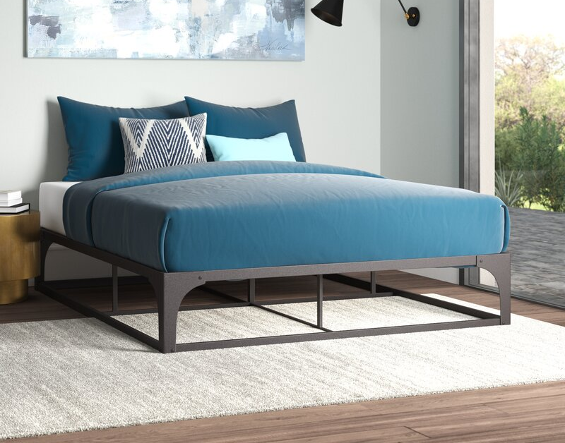 lifestyle photo of gray steel bed frame in bedroom