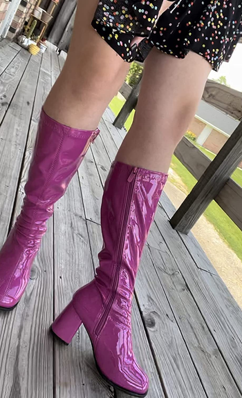reviewer photo of them wearing pink go-go boots