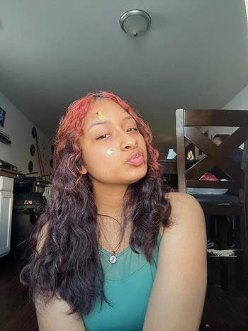 shiny stickers connected  reviewer's face