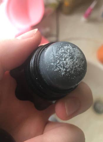 the cap off to show the salt on the top of the remover