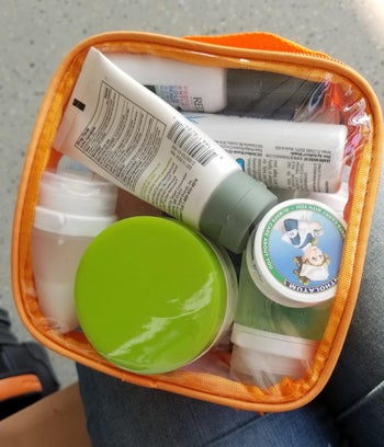 reviewer photo of TSA-compliant skincare products inside clear toiletry bag