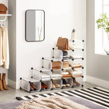 Shoe organizers successful  a stair-like statement   with shoes, bags, and covering  wrong  successful  a country   