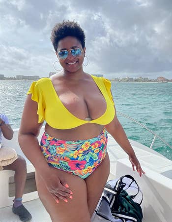 reviewer wearing the yellow suit with colorful bottoms