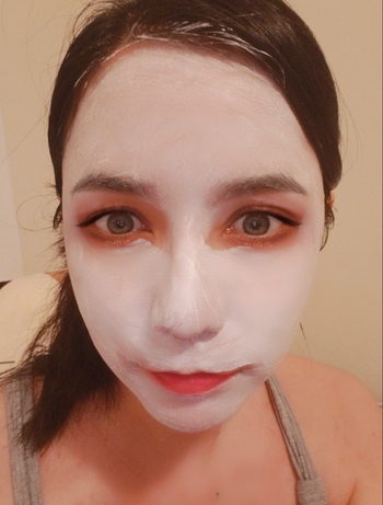 Reviewer with the white mask spread over their face 