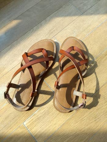 A reviewer photo of the brown sandals