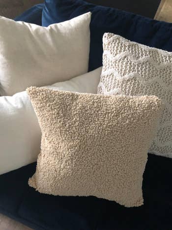 a reviewer's sofa with the wool pillow covers
