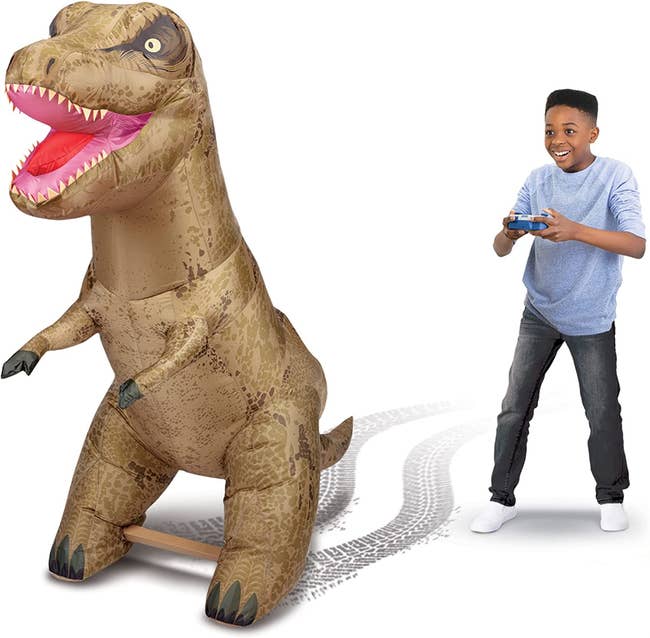 a child playing with the T Rex