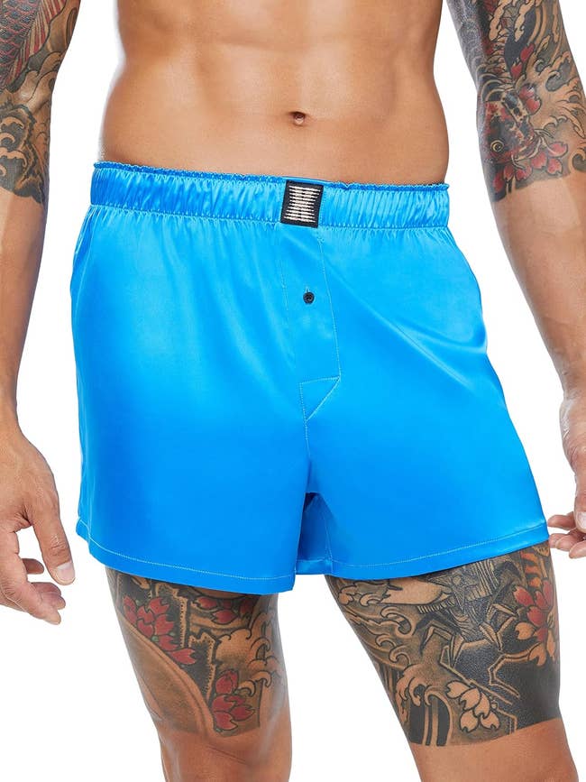 model in blue satin boxers