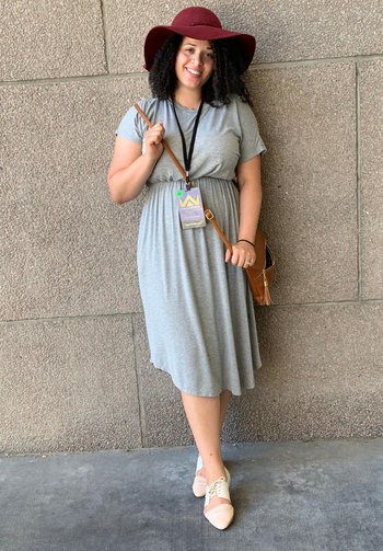 reviewer wearing the gray midi dress