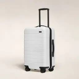 a white hard case suitcase