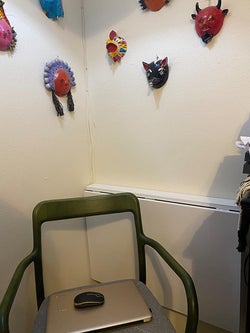 same reviewer's desk fully folded down and chair in front of it