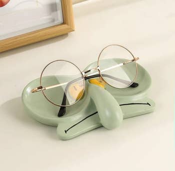 the tray holding a pair of eyeglasses