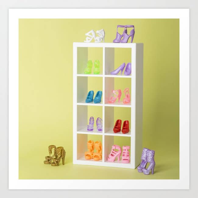 an art print of barbie shoes in a shoe storage system