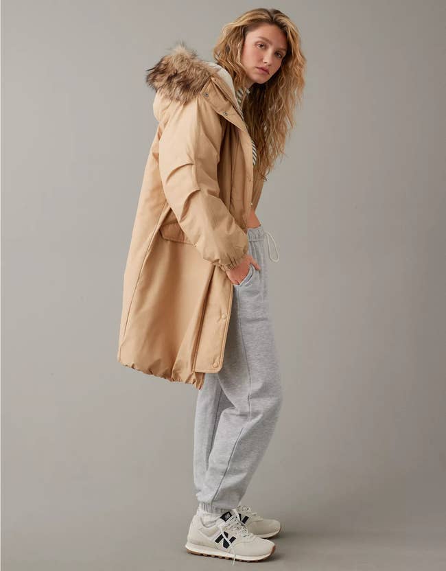 model wearing long parka jacket