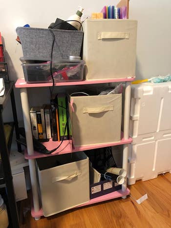 reviewer photo of fabric storage cubes on a shelf